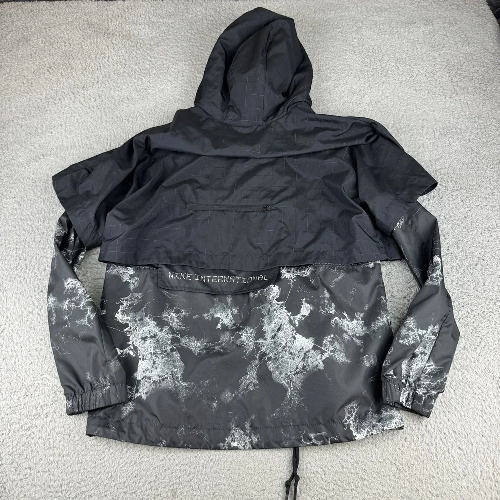 Nike International Jacket Womens Large‎ Black Print Hooded Windbreaker Running